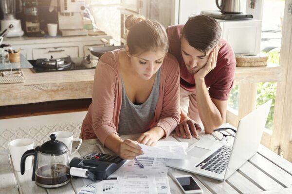 Couple Reviewing Insurance Options for Plumbing Repair in Driggs, ID